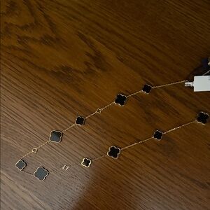 Elegant Black and Gold Clover Necklace